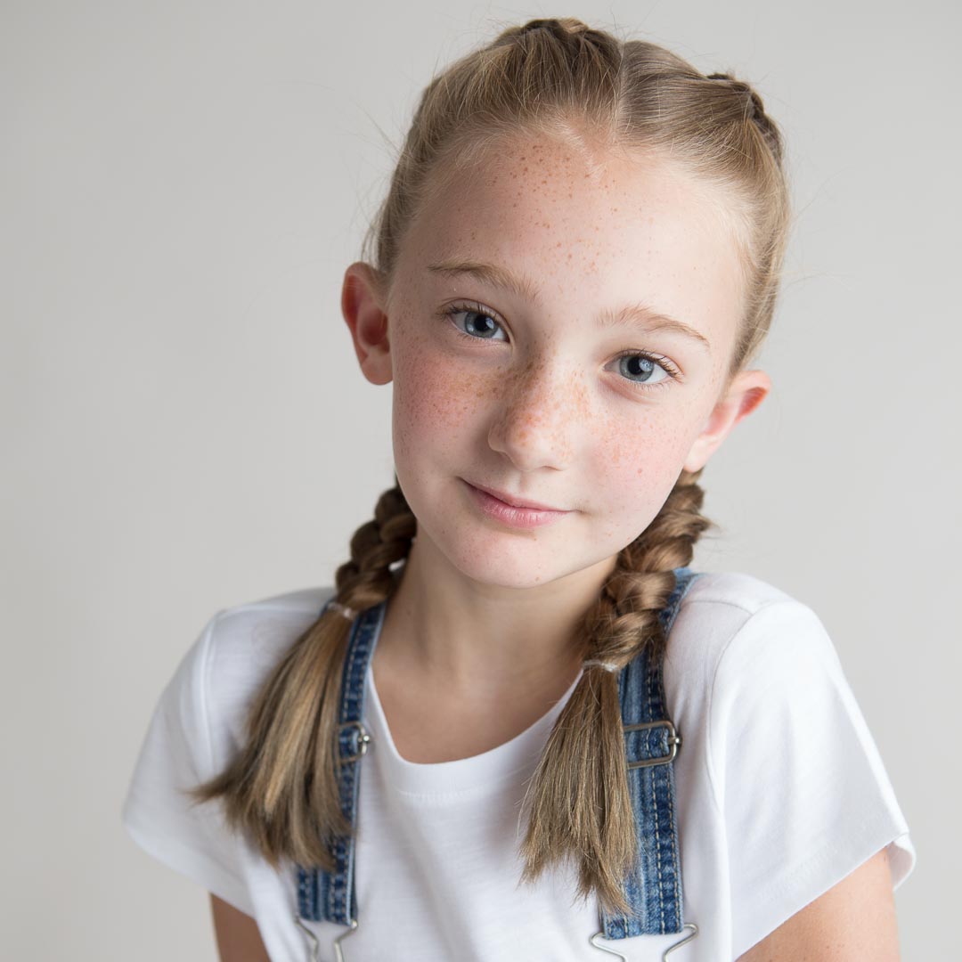 Children's Headshots with young girl in braids in Suwanee photography studio