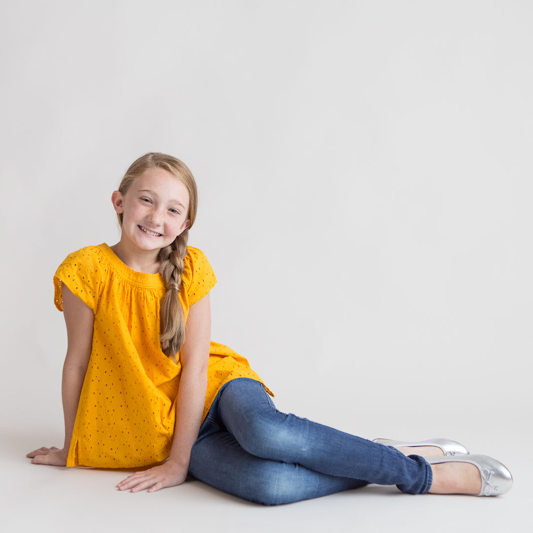 Child Headshots with young girl in yellow shirt
